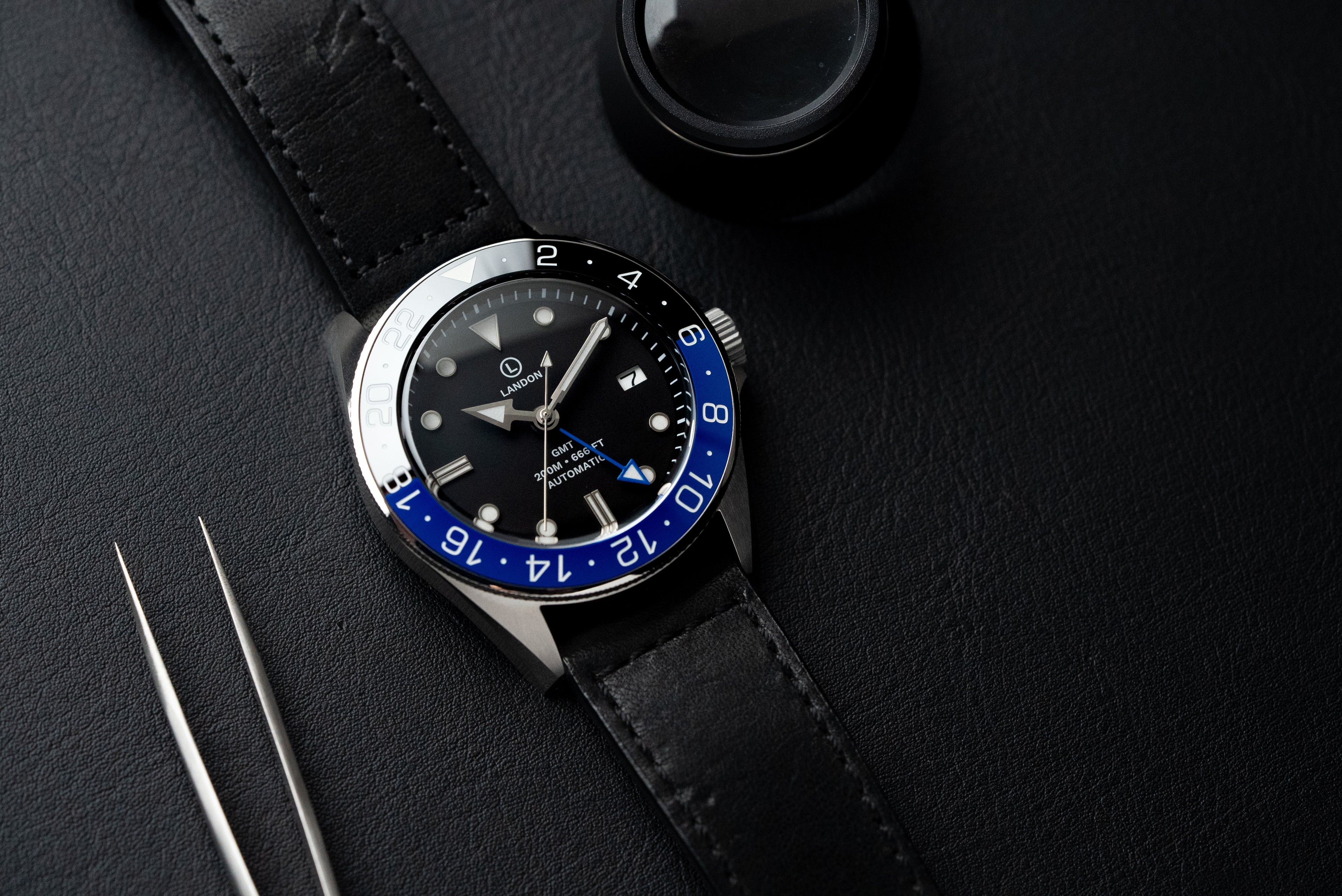 Custom GMT dive watch by EONIQ. Fully customizable watch dial with super-lume, powered by Seiko NH34 2 timezone GMT movement